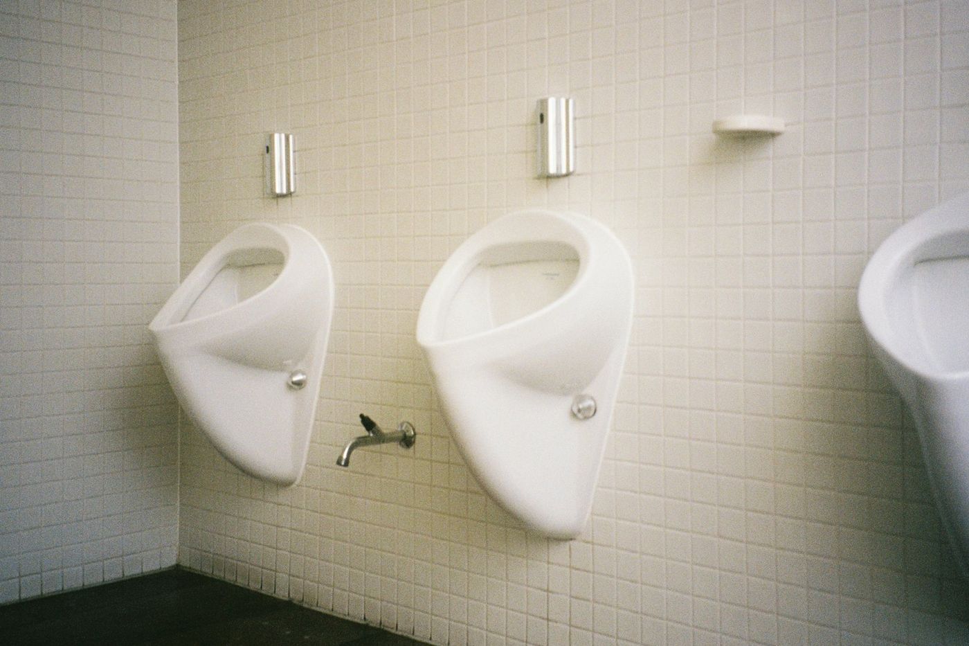 Commercial restroom with wall-hung urinals